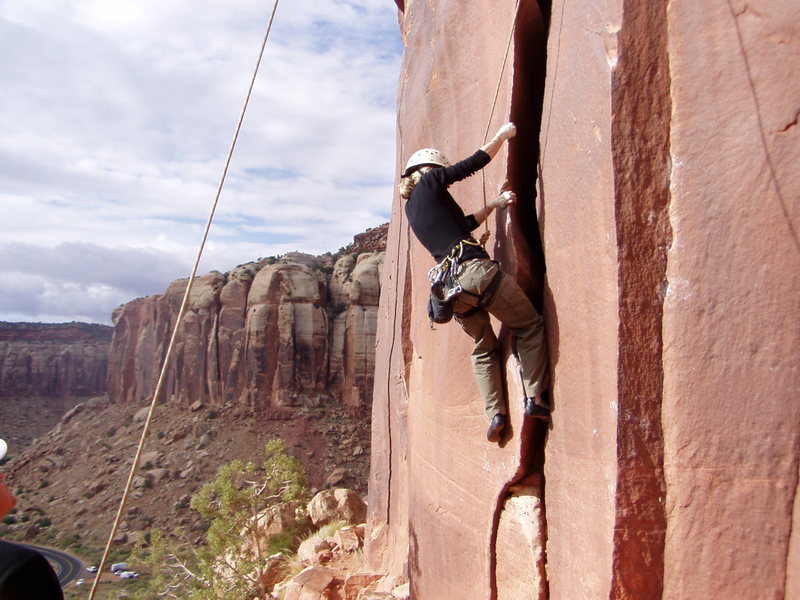 Jenny climbs the wide start. Photo by J P Boyd.