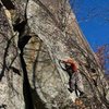 Jamie McNeill on FA of Eatin' Tripe and Lichen It.<br>
Here, he is just returning to the left after bypassing the OW start via a good handcrack.<br>
He will continue up the wide crack to the right of the overhang.