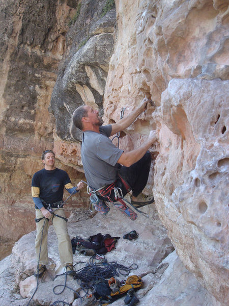 First ascent of Bluto Tastes An Olive. Erik Wolfe climbing