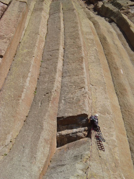 Trevor "The Wizard" Bowman, skillfully navigating the double roof on the 1st pitch of Double Edge Blade, SW Face, Devils Tower, WY. October, 2008. Photo by www.devilstowerlodge.com