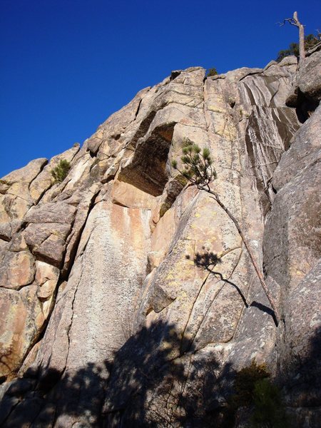 Fascination Street climbs the major dihedral to the roof then moves up and left past the roof.