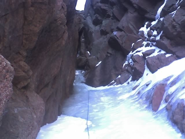 I snapped this pic on my cellphone at the first pitch. This was the LAST of the good ice. Compare this to the pic taken with more snow and ice and you get the idea of how f&*^d up this route was when "dry".