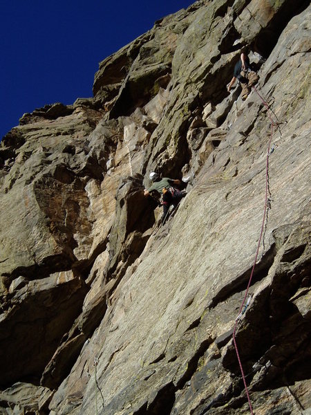 Luke on the overhang/corner with another climber at the ceiling of Learning to Crawl.