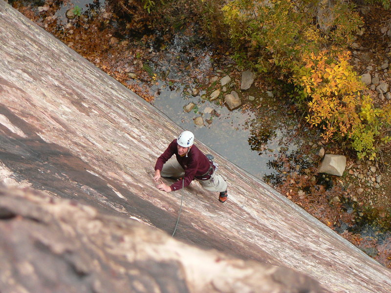 Starting up the first pitch on the slabby 5.5 section.