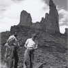 I've added a photo of the two first ascenitionists that is from the Museum of Moab. It was taken by Fran Barnes. The museum also has one of one of the two guys just about to summit. I'll try and get a copy of it from the records room. Its from afar and you can see the dust on the rock near the new bolts. I think we need to keep in mind that desert climbing required a different mindset then. There were no large cams to utilize when going up the crack, etc.