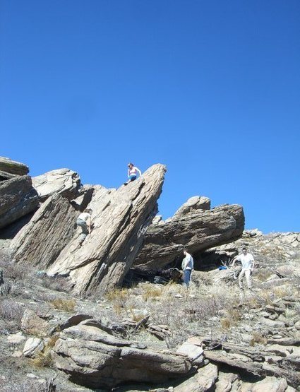 Climbers on backside of Sharktooth. You can see "the overhang boulder" behind the people on the ground