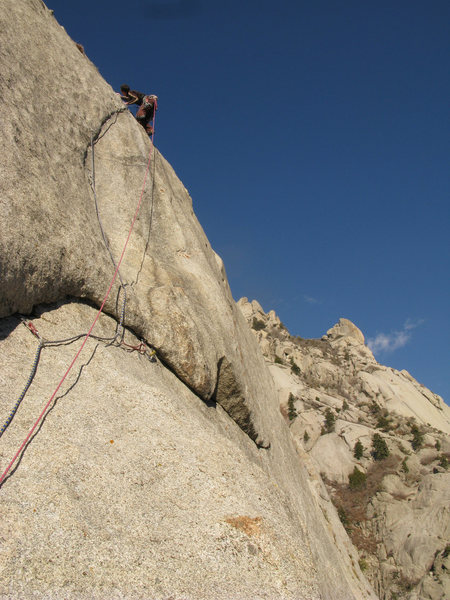Lance climbing the crux section on the FFA of the Lateral Fin.