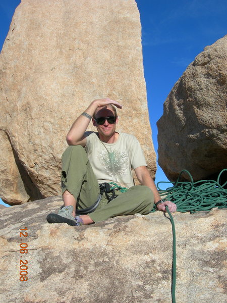 Brandon sitting in front of Ballbearings Under Foot. Nice shoes dude.