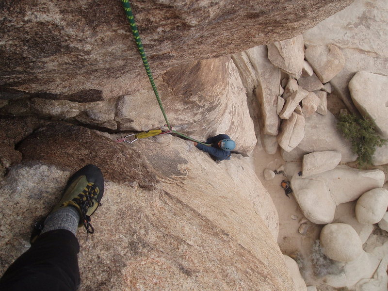 Nate swimming up the crack, nearing the top of the route.