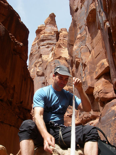 A recent study (April 30, 2008) has shown that long falls in the crux dihedral can cause severe ankle trauma.<br>
Taping a splint for the hike out. Cauldrons and Warlock in the back ground.<br>
The dihedral takes seemingly good green aliens and blue metolius... however, 4 of them popped. WHy the 5th held is a mystery.
