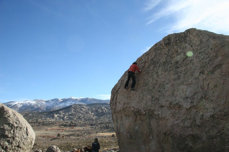 Climbing the easy upper slab of Problem A