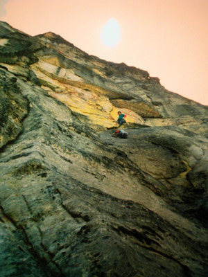 Jay Koopsen and Dane Burns on the 2nd pitch of Tsumani during the 1st ascent, 5.11+ R on the East Face of Chimney rock.  F/A 1986.