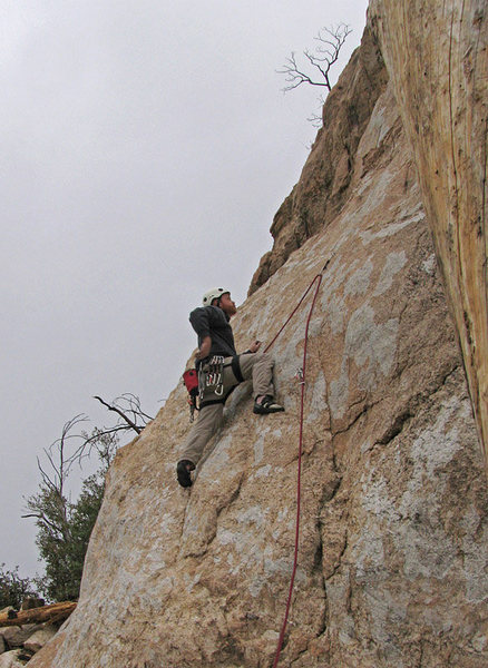 Yours truly, chalking up (despite the cold) for the slabby crux of "T and T" at the Cave Wall.