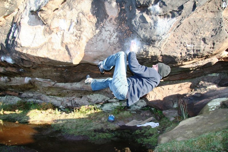 Mike mid way through the crux section of the Cave Righthand, V4+