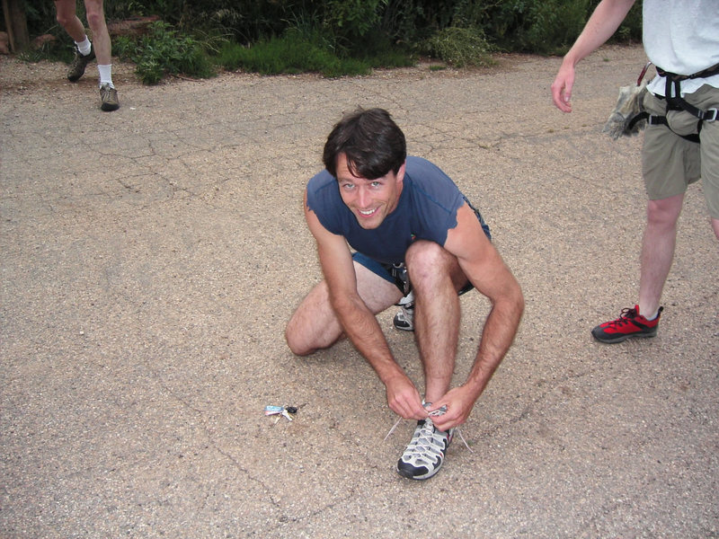 Tony Bubb lacing up prior to a flatirons race, early 2000's. Photographer Bill Wright.