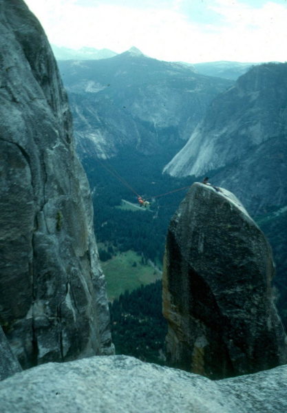 Lost Arrow Spire Tyrolean Traverse, Yosemite.<br>
Glacier Point is near foreground; Starr King in distance.