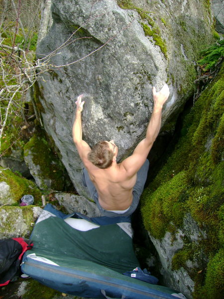 Nate working the prow project on the backside of the Bullitt Boulder.