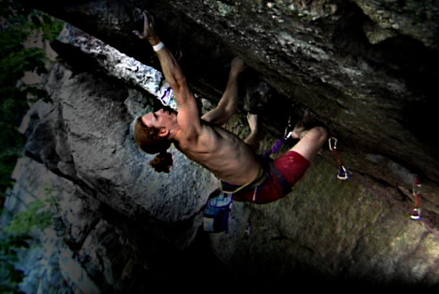 Kansas City, Near Traps. The greatest 5.12 move in town. Climbing barefoot. I make the crux toss for a send.