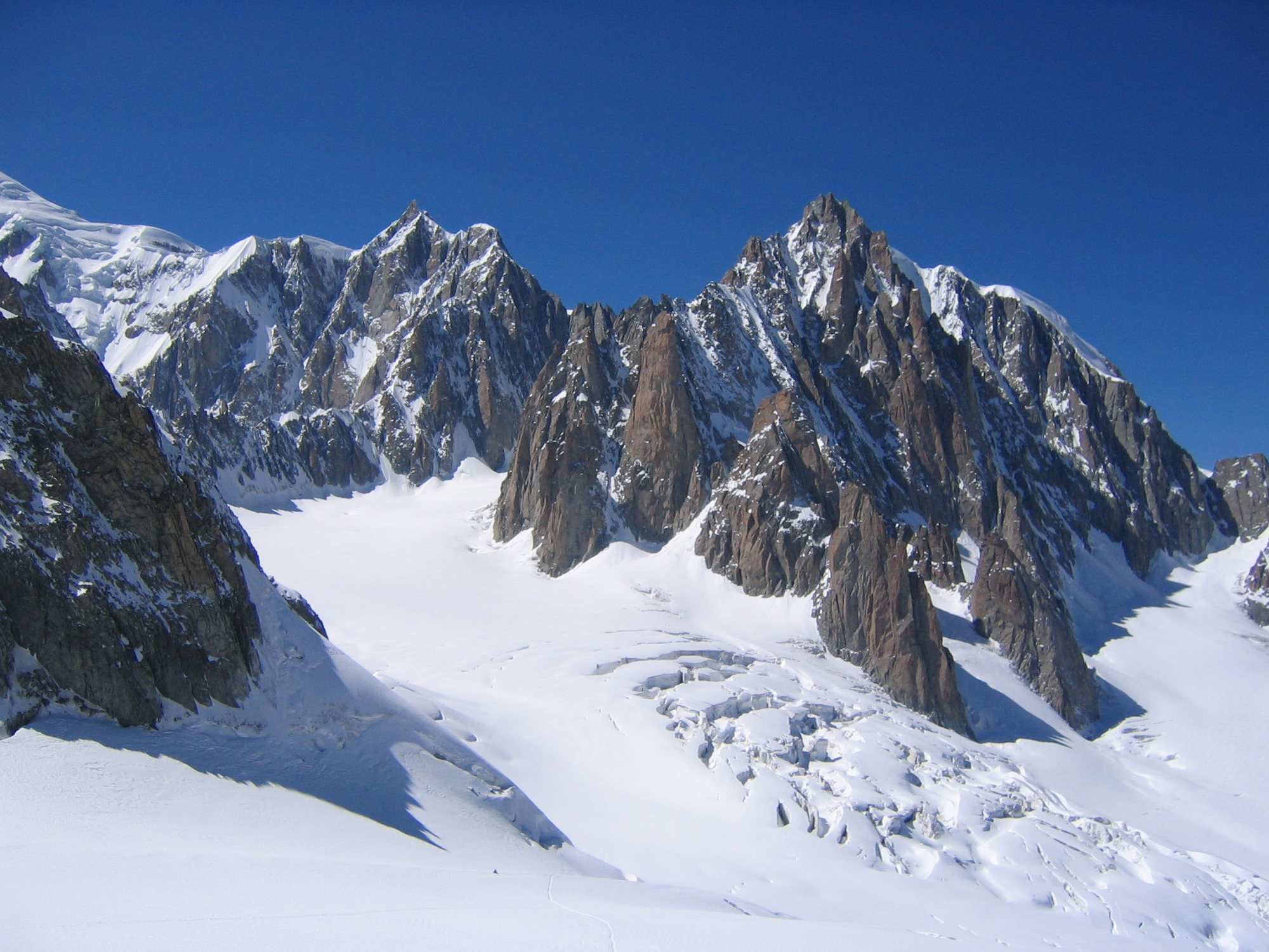 North Of Mont Blanc Lie The Awesome Walls Of Mont Maudit (left) & Mont 