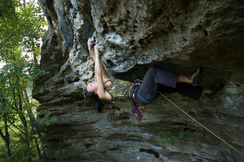 Manifest Destiny may not be 5.12a for those of average height, but for Linda (4' 11.5") it is definitely solid 5.12. Full iron cross reach out the roof then good body tension to release out with out swinging.