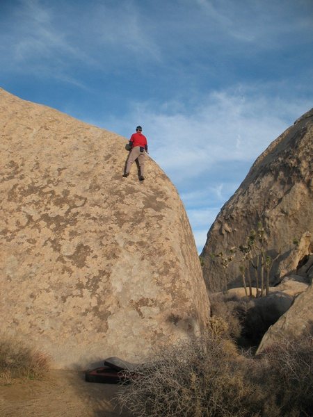 High above the pads on The 4th Amendment (V0 R), Joshua Tree NP