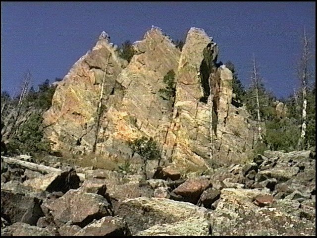 Dihedrals caused by fractures and vertical uplift along fault during Laramide Orogeny.  Cadillac Crag, Eldorado Canyon, CO.   Fountain Formation here is well cemented by adularia cement because here the rock lies on the Colorado Mineral Belt.