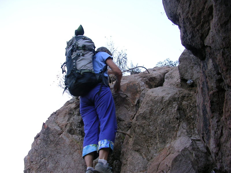 It is a long way from The Grotto over to the Kamikaze Cave. You're getting close when you reach the four rung downclimb.