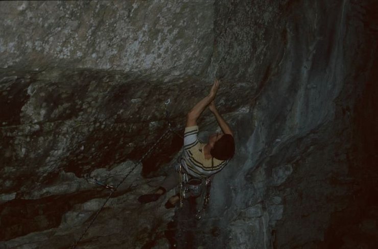 A crux move on Reanimator. The wall is very steep and you have to roll up on a very shallow pocket.