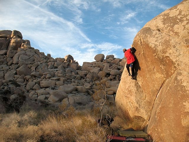 James near the top of Dripper Left (V2), Joshua Tree NP
