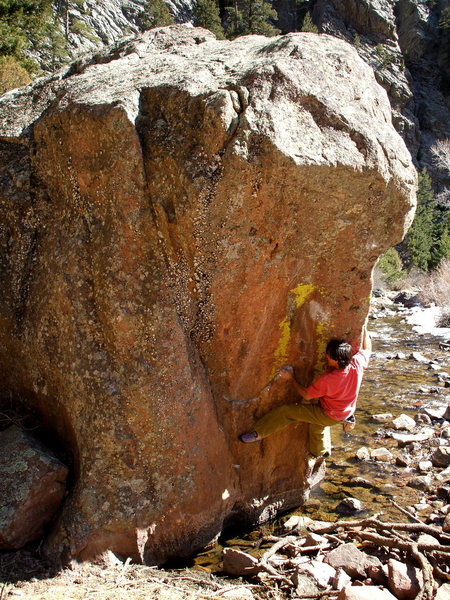 BH working on the new Robinson arete on Water Boulder, east, and creekside from Supremacy Slab.