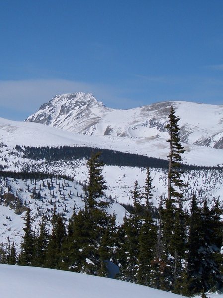 South Arapaho, winter, viewed from the south-southeast. Skywalker Coluoir visible below summit. Recent snow makes coverage look more generous than it typically is in midwinter.