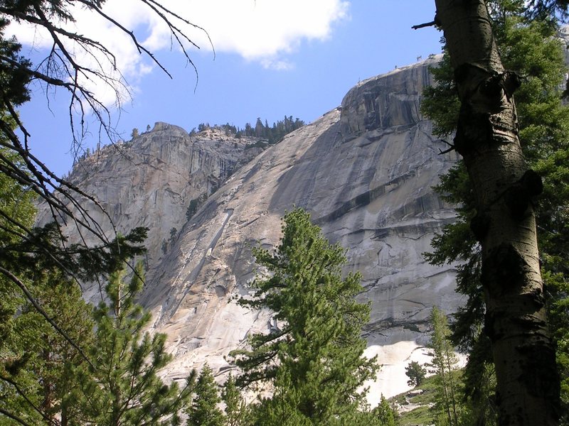 Twenty miles up the Merced from Yosemite, past Washburn Lake, the trail passes by this 2,000' piece of golden granite.
