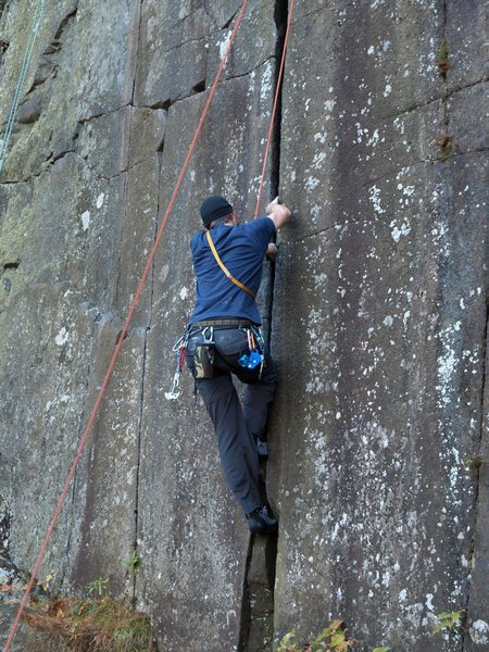 Trying to get off the ground on Yosemite crack. Photo by JLE