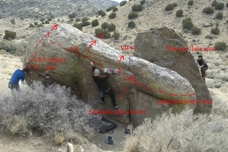 View of the north side problems. Dan is moving into the crux of the middle problem (tops out after matching on the crimps he's reaching for with his left hand). Topping out straight up is easier, continuing on through the leftward traverse is harder - shares switchfoot topout (the problem which seems to be coming out of Chavez's head, on the left side of the photo).