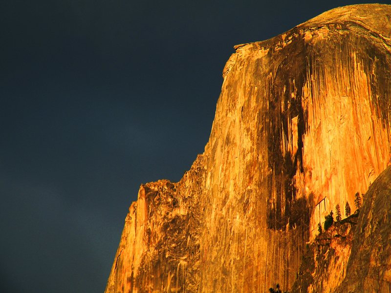 Half Dome catches some sun during a storm