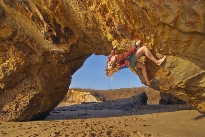 Johanna Lefever bouldering at Panther Beach, Santa Cruz, California