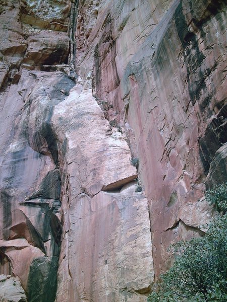 The route follows the obvious line. up through the black cracks at the top.
