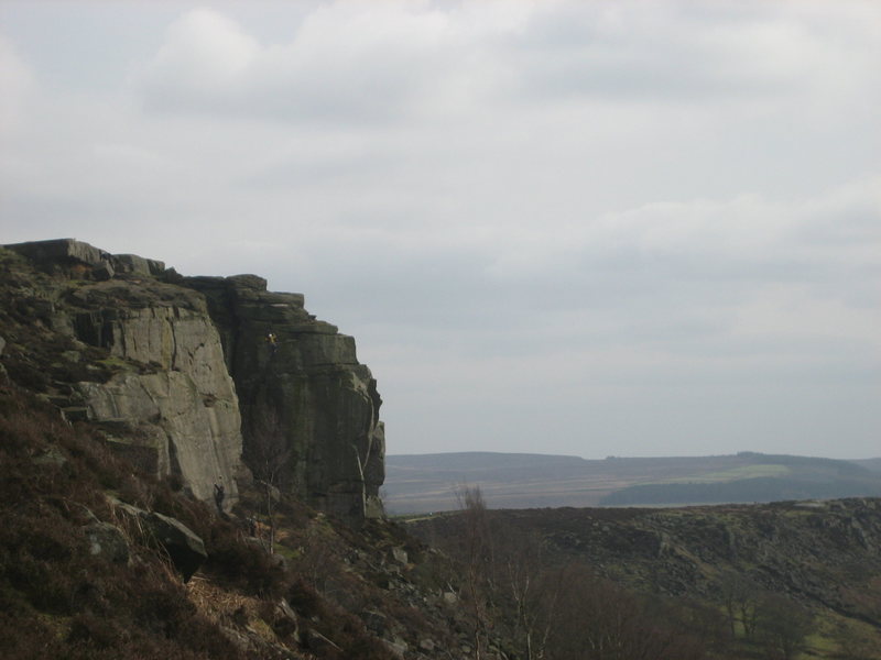 Climber (yellow) high on P.M.C. 1