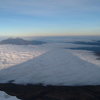 Shadow of Cotopaxi from the regular route, a very enjoyable and scenic snow climb. Illinizas in the distance.