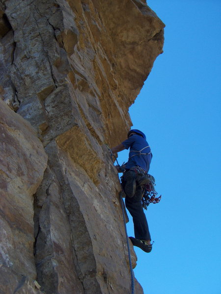 Beginning of the crux pitch on The International, Glenwood Canyon. Chris is shown here climbing the totally hollow and precarious flake below the roof.