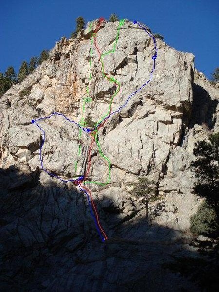 The Blue line is my first attempt to climb left side. It was an adventure. The gear was sparse.<br>
<br>
The red line was my second attempt. It was a little closer I think.<br>
<br>
Green line is the third climb. We rapped in from the top, since the boulder falls approach was closed. Then the black groove was wet so I traversed right before moving up along some sport route. The third pitch was run out and pulled over a 9+/10- roof.<br>
<br>
You can go wherever the hell you want on that third pitch!