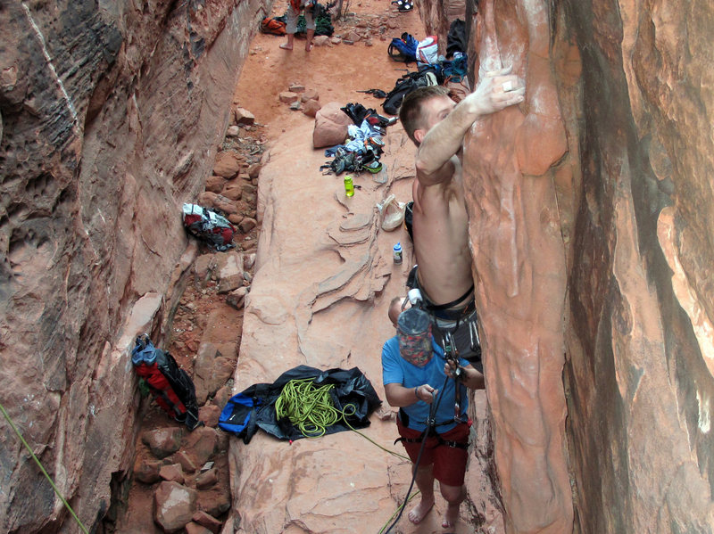 throwing the only difficult move of the climb--from the overhanging face to a big jug around the right side. Crude Control in the Black Corridor at Red Rocks