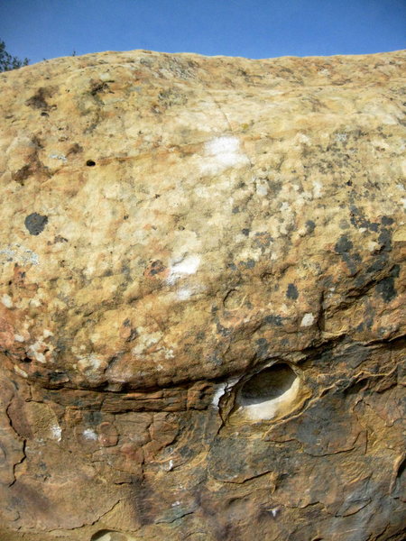 Call Me starts in the hueco, and the manufactured edge and one of the better slopers are chalked.
