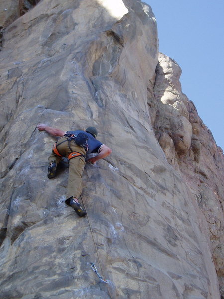 Jimmy Menendez on the crux move of Recession Arete.
