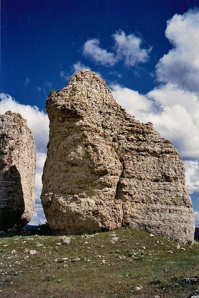The route lies just right of the obvious weakness in the center of the face and follows the easy ridge to the summit.
