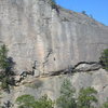 The northern side of Upper Red Tail wall.  The climber is on <em>The Assholes of August</em>.