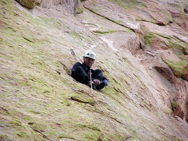 Luis sitting in a hole in the middle of a nice route on Sheeps Head heck of a no-hands rest... :-)