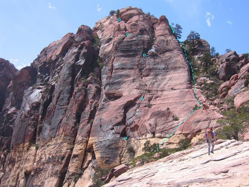 This is the route we took. However, multiple variations of the climb are<br>
available. The varnished face to the left for several pitches would also work.