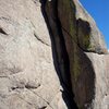5.8 Dihedral on the NW face.  Gear fingers to hands. Bolted anchors. ~ 50'.