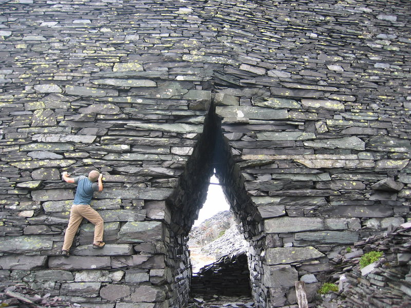 Having fun bouldering over the arch doorway and down the other side. Who needs to grow up !!